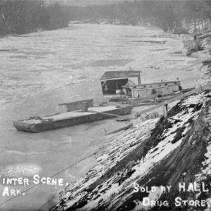 Barge and houseboat on frozen river