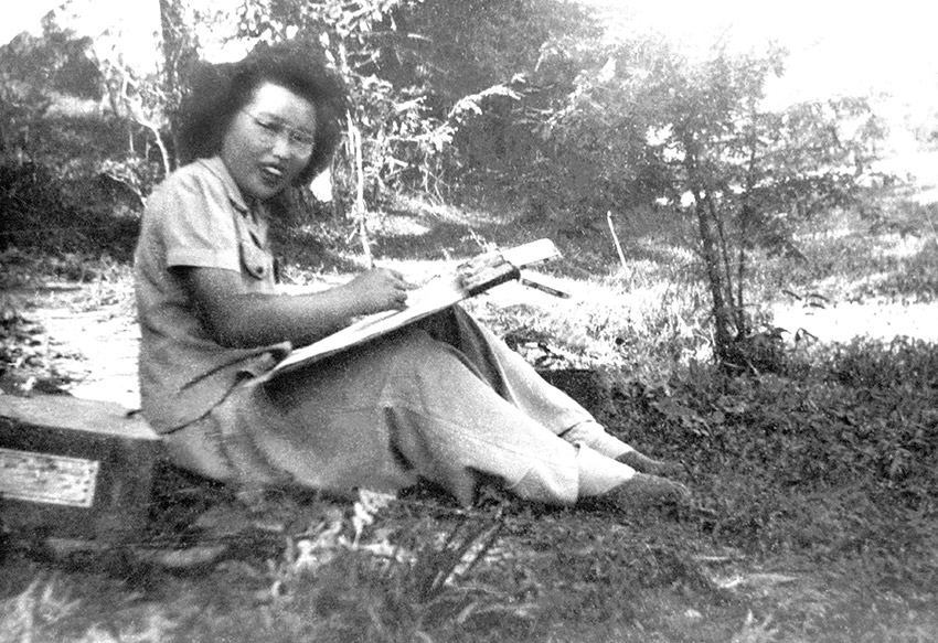 Asian woman sitting on the ground