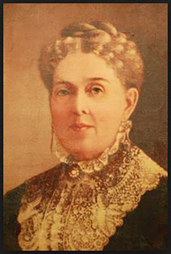 White woman wearing high lace collar and hair up