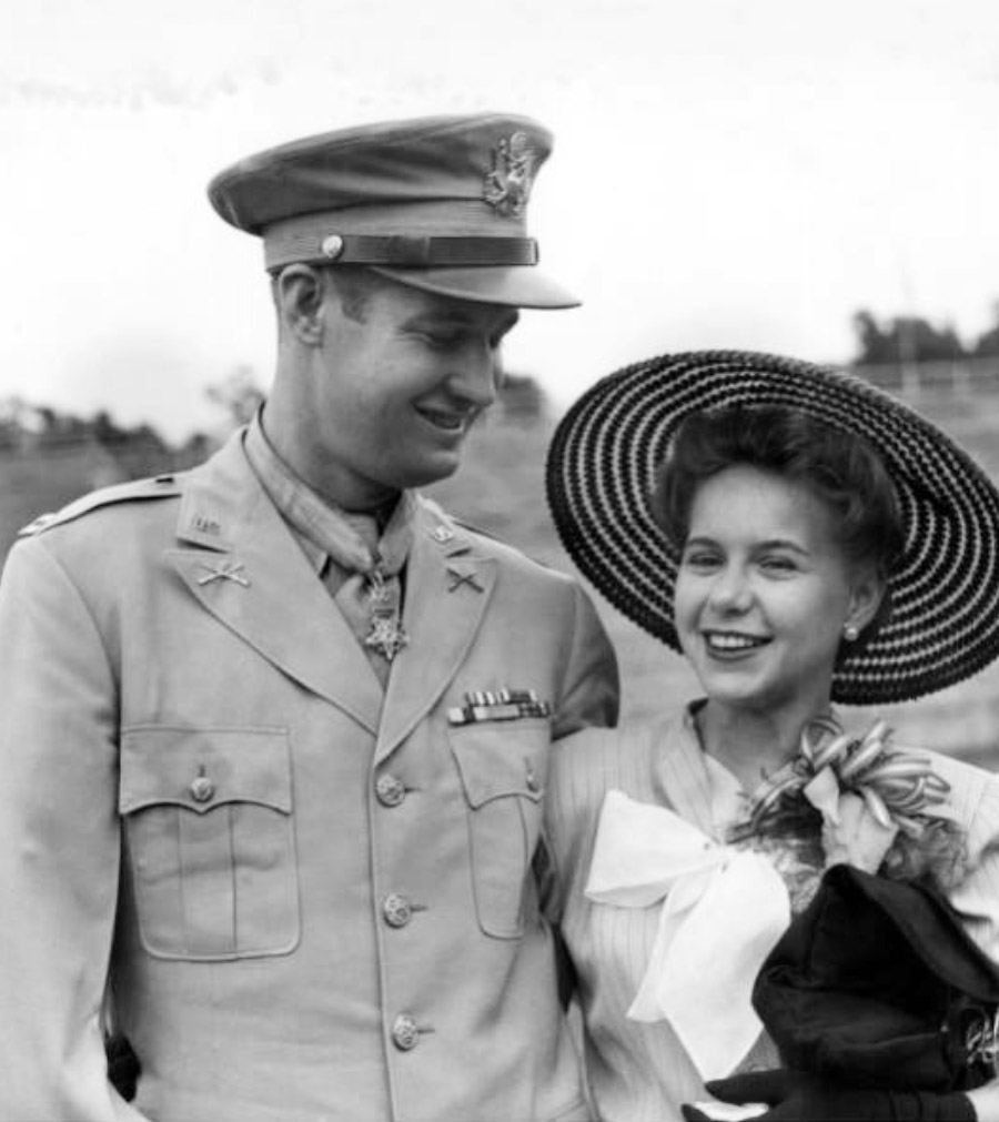 White man in military garb; white woman in hat