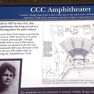 blue and white Park sign with information and drawings of the CCC built amphitheater at Crowley's Ridge State Park
