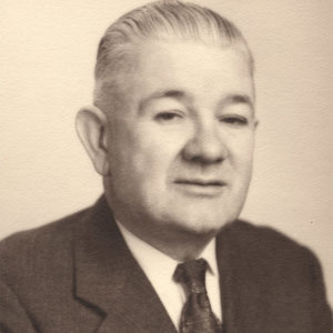White man with white hair in suit