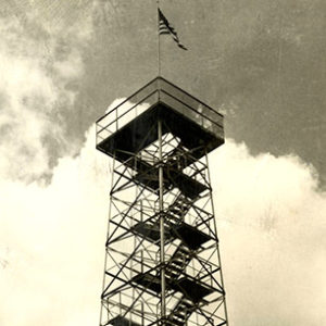 Steel observation tower with buildings at the base