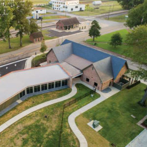 Overhead view of multistory building and surrounding roads