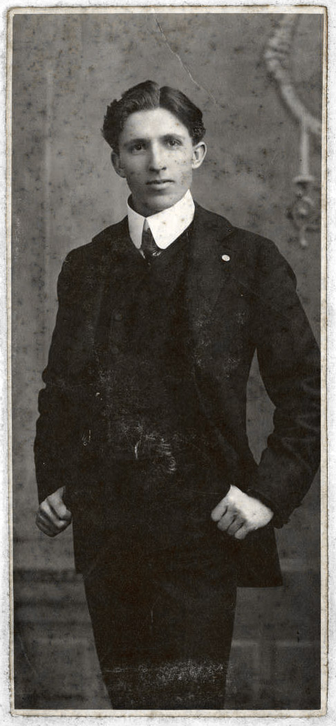young white man wearing suit standing