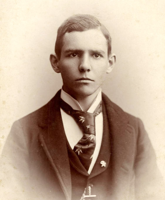 Young white man in coat and tie