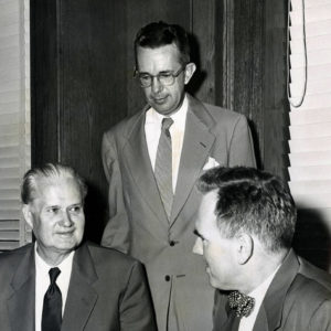 Three white men in suits and ties