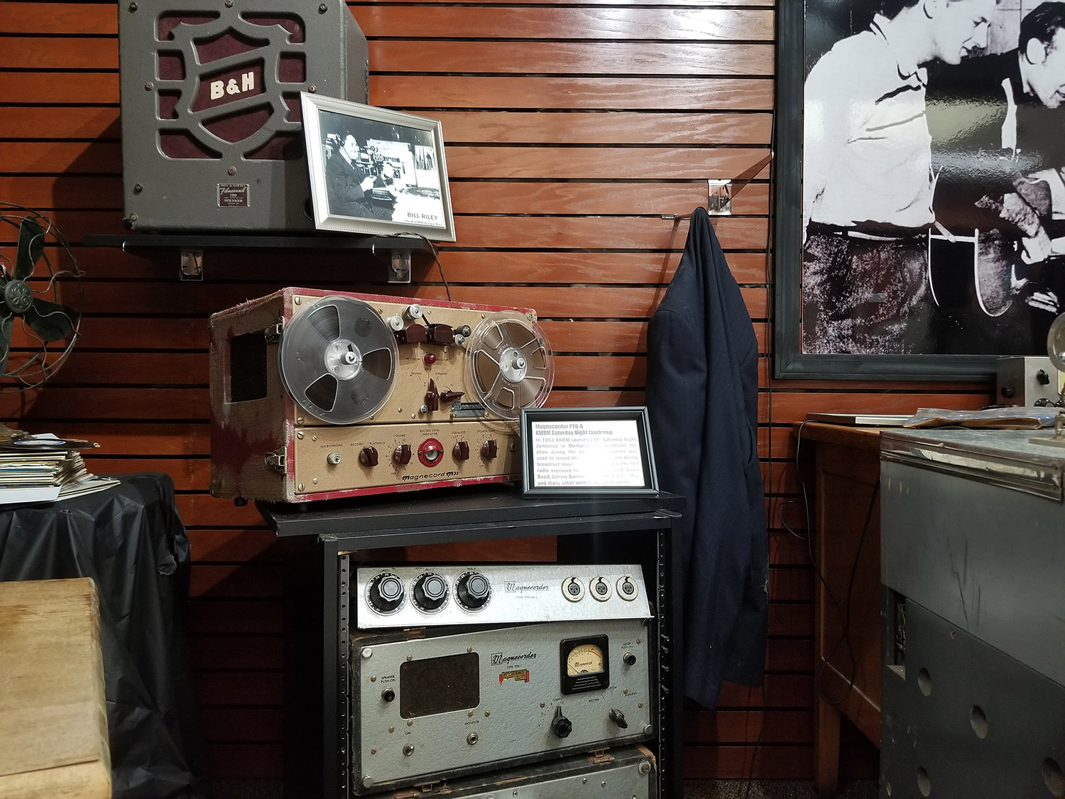 radio station broadcasting equipment and photos on display