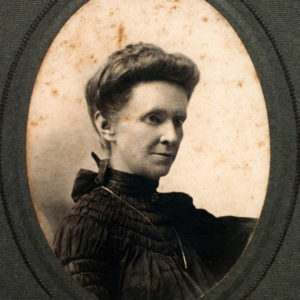 matted oval photo of white woman with hair up