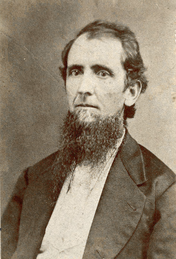White man with long beard posing for portrait