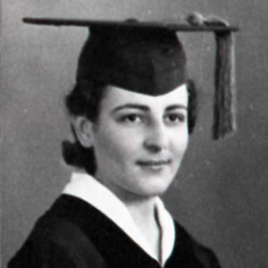 dark-haired woman in graduation cap and gown