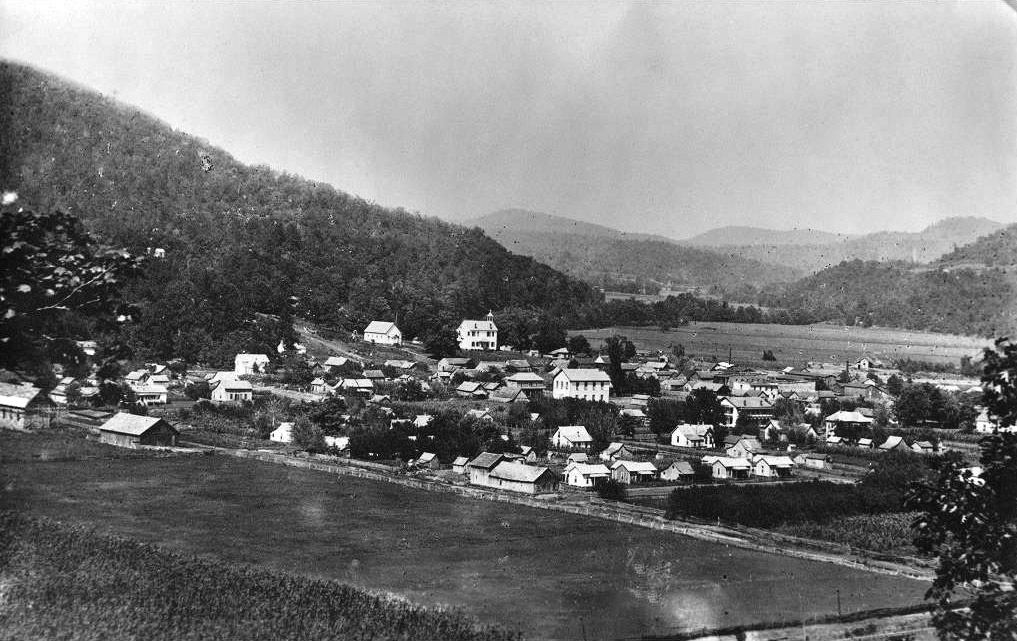 Overlooking small town set amid hills and valleys