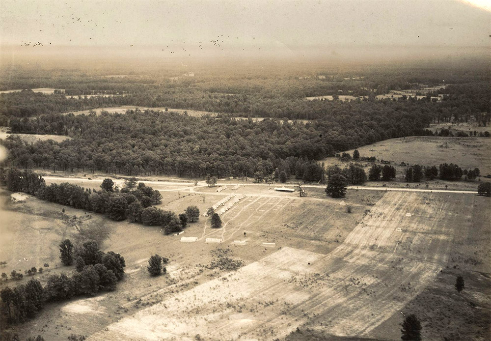 Aerial view of tent city amid trees