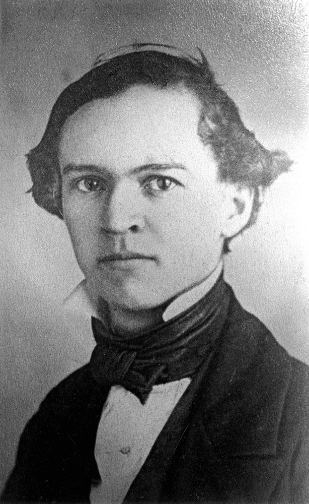 Young white man in cravat and suit