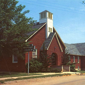 Red brick church building with short tower
