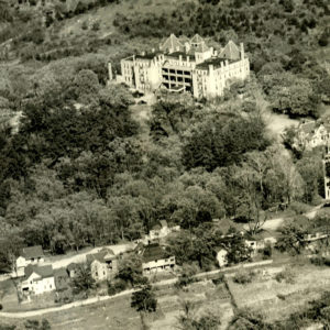 Aerial view of houses and large hotel