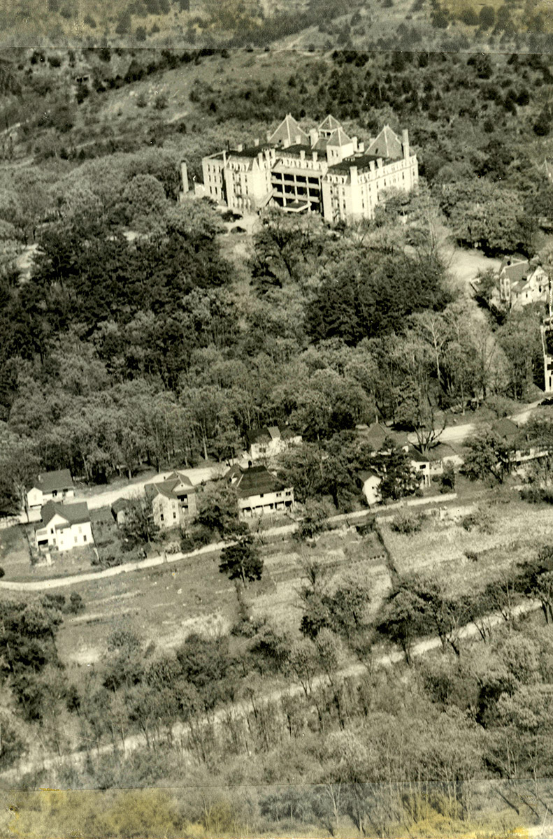 Aerial view of houses and large hotel