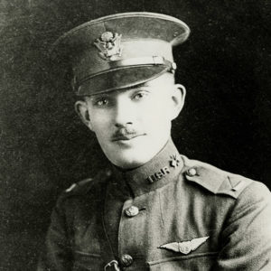 White man with small mustache posing in military uniform