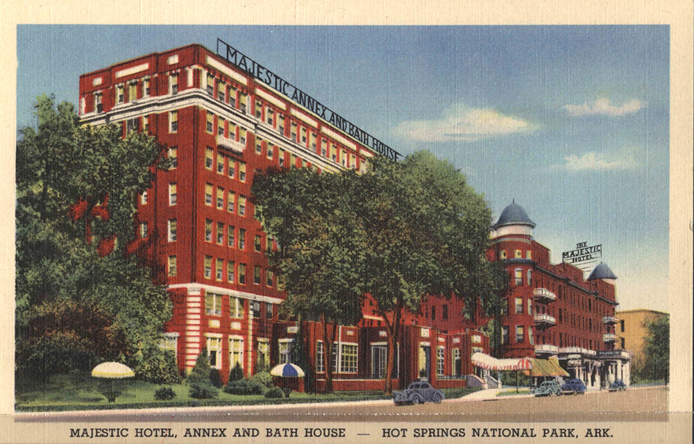 eight-story red brick building with large sign saying Majestic Annex and Bath House