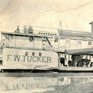 Steamboat at dock on river