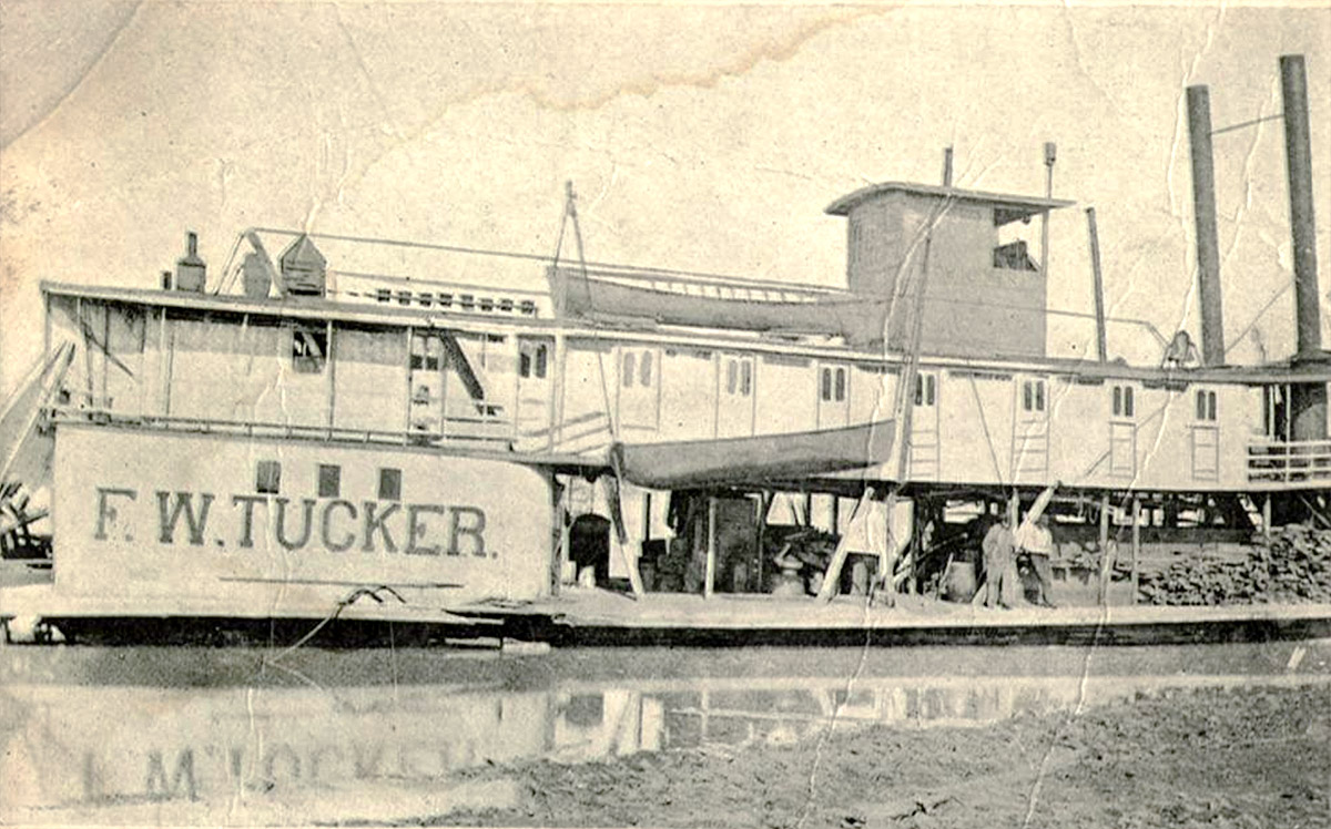 Steamboat at dock on river