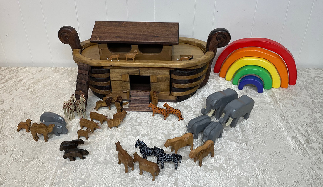 Toy ark with animals and carved rainbow