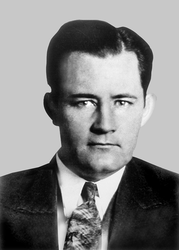 White man in coat and tie