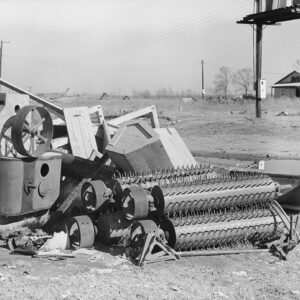 Machinery on the ground with yard and small building