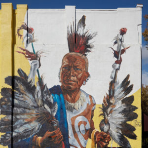 Mural featuring a Native American man in traditional garb