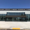 Multistory glass and metal building with letters across the top reading "Saline County Career Technical Campus"