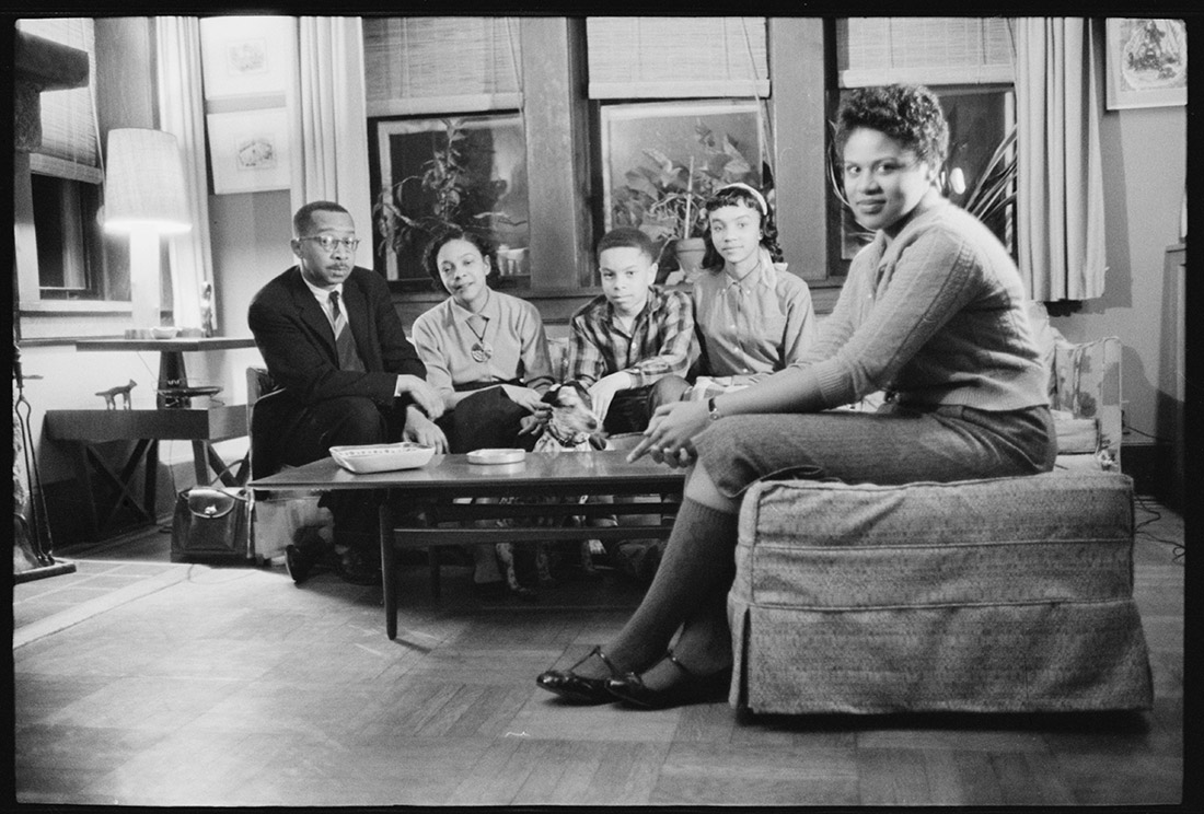 African Americans seated in living room