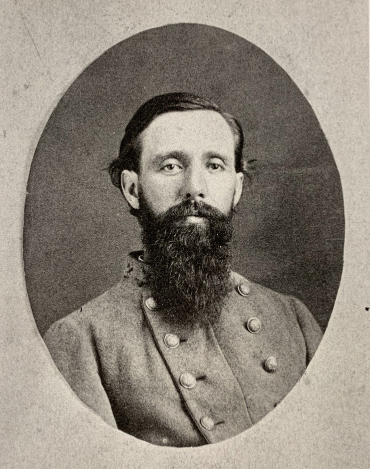 White man in military garb with beard