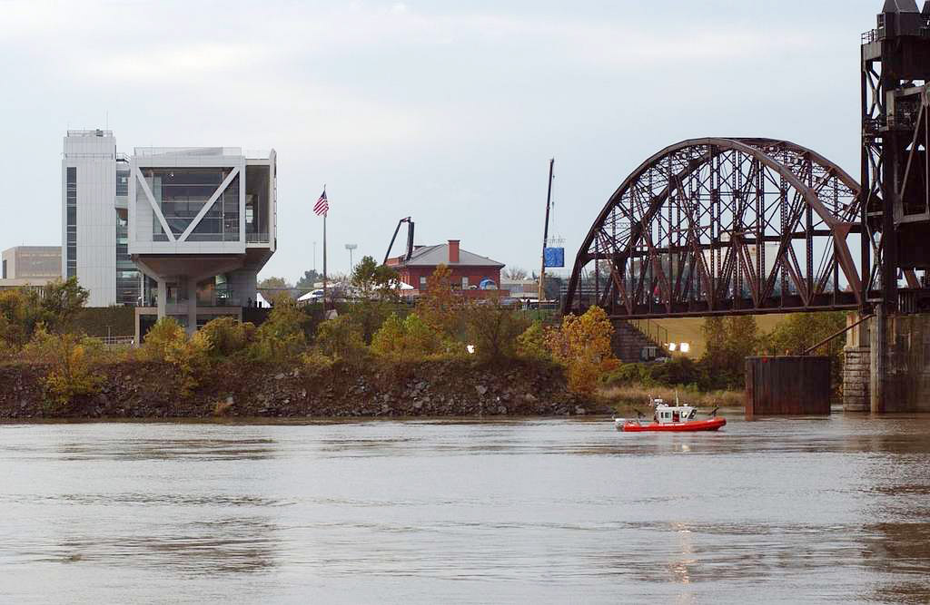 Silver building and bridge seen across river
