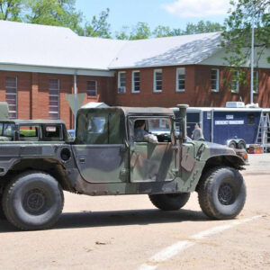 Military vehicles driving through small town