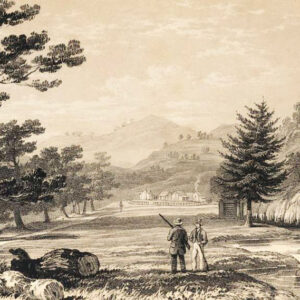 Two men standing in a valley looking into the distance