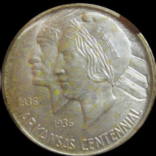 Half dollar coin showing an Indian head and the head of a 1930s woman