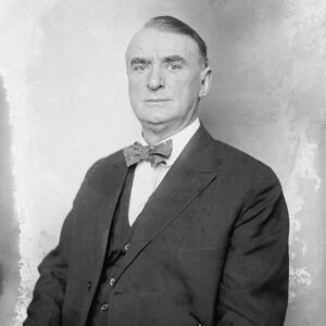White man in suit with bow tie