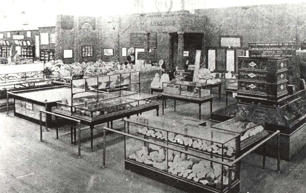 Display cases of stone and metal inside large hall