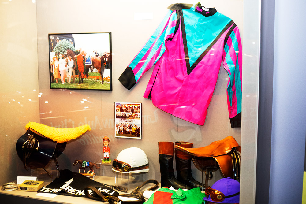 Display featuring jockey clothing and accoutrements