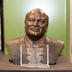 Bronze bust of man on a display with plaque