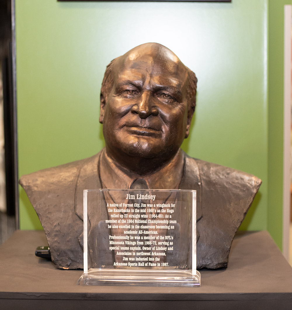 Bronze bust of man on a display with plaque