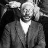 African American man in glasses and suit