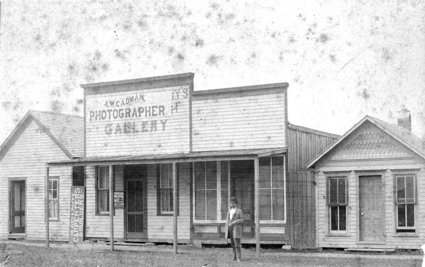 Storefront with porch "A. W. Cadman Photographer Gallery"