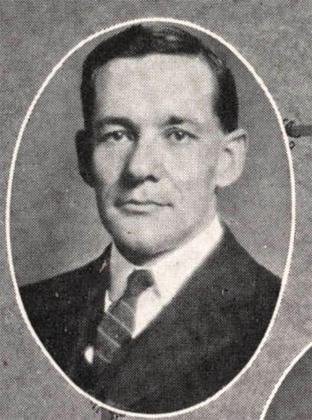 White man in suit jacket and tie