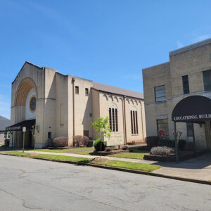 Blond brick church buildings with awnings