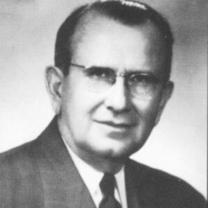 White man with in suit and tie and glasses