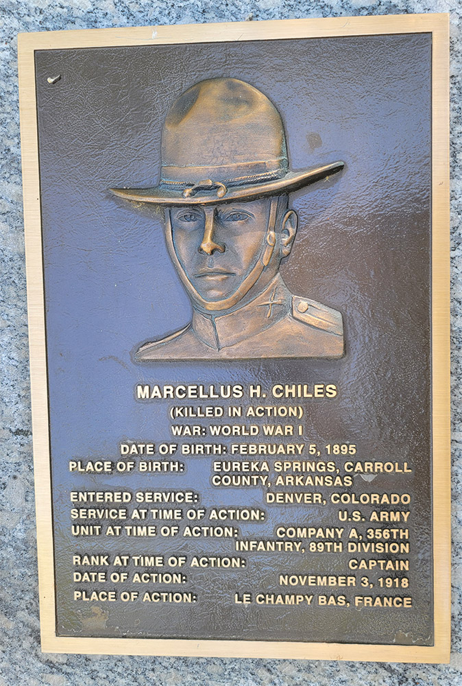 Man's face on bronze plaque