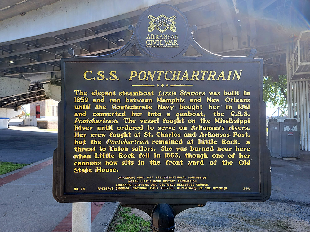 Black sign with yellow letters saying "CSS Pontchartrain" and giving historical information