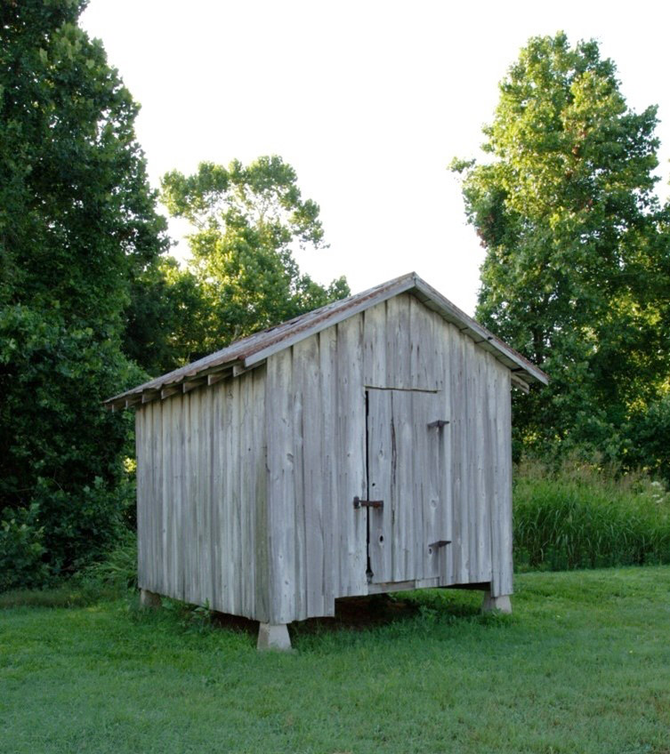 Tiny wooden building with no windows