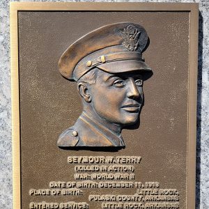 Man's face on bronze plaque